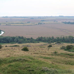 Portus Lemanis Roman Fort, Lympne. The sea has retreated and Dungeness Power Station is visible on the horizon.