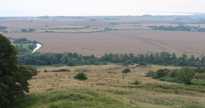 Portus Lemanis Roman Fort, Lympne. The sea has retreated and Dungeness Power Station is visible on the horizon.