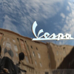 Reflection on a Vespa moped, Rome