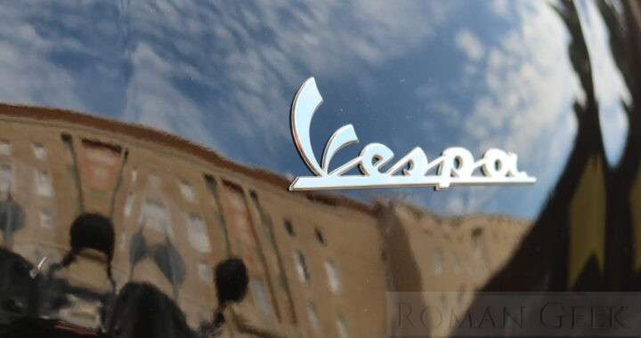 Reflection on a Vespa moped, Rome