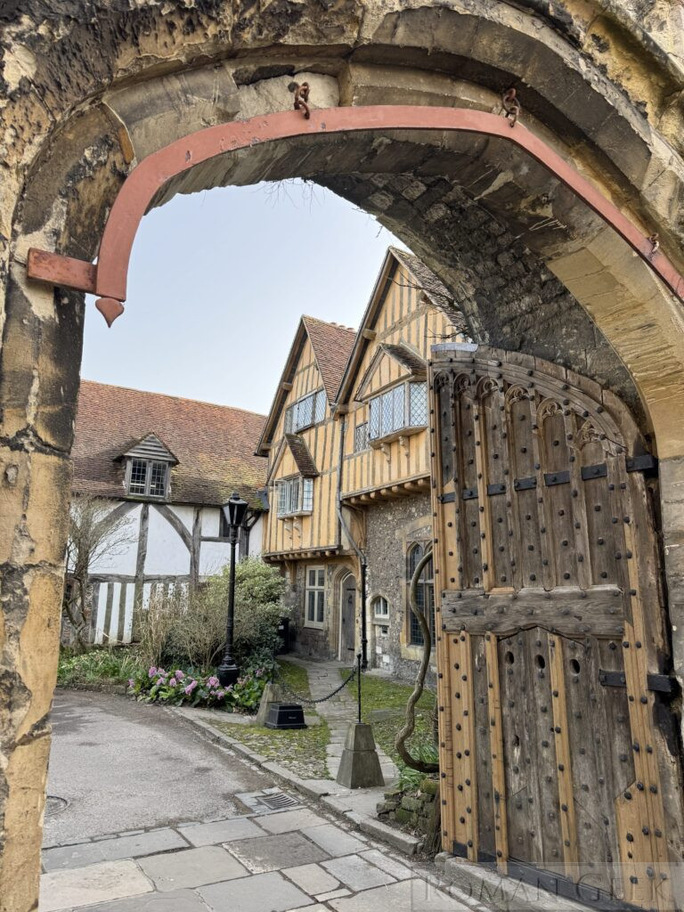 A rare Medieval Archway set in the Priory Close Wall with its original traceried wooden doors.